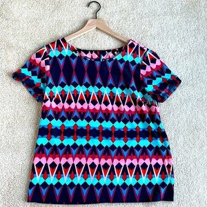 Tags have been removed, believe it is a S. 100% polyester and brand is J.Crew.